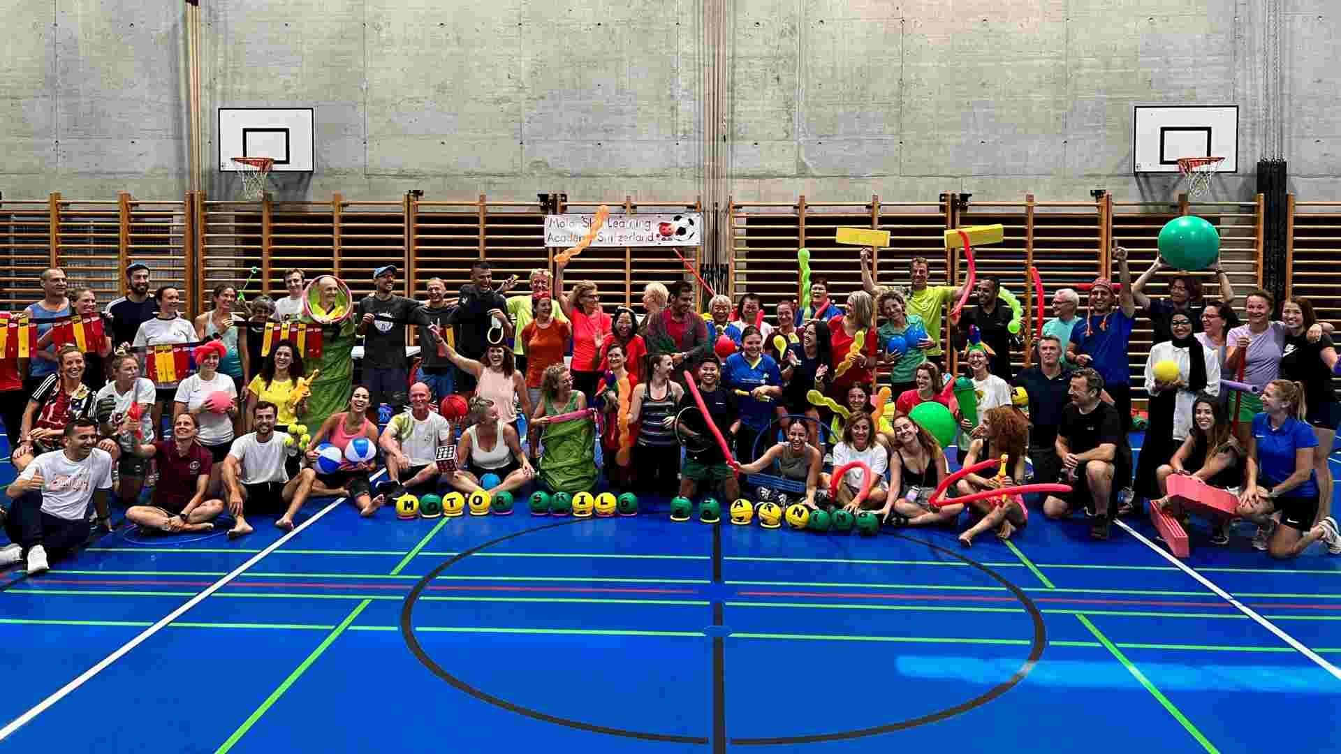 Motor Skill Learning workshop participants celebrating with colorful equipment